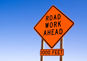 road construction sign that says "Road Work Ahead: 1000 Feet"