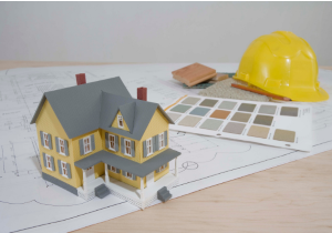 single-family home model with site plan, paint color card, and hardhat